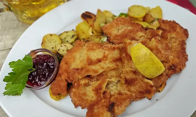 Bavarian schnitzel, pan-fried potatoes, and lingonberry jam